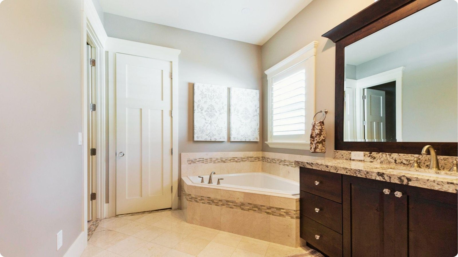 Spacious bathroom with light gray walls in eggshell sheen, balancing soft glow with moisture resistance.