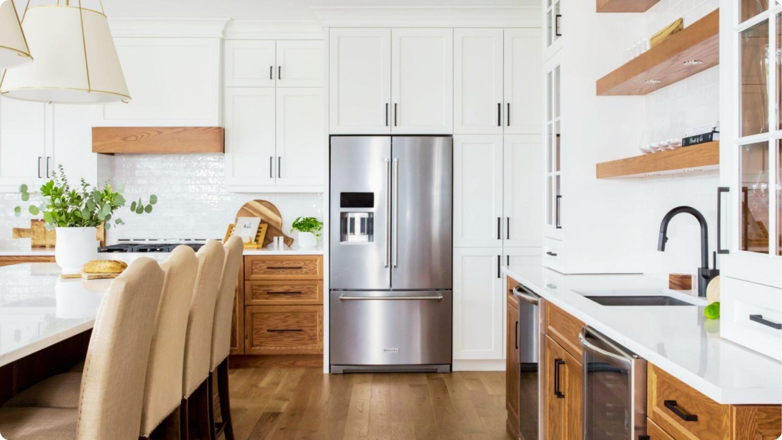 Two-tone farmhouse kitchen with white uppers and medium oak lower cabinets.
