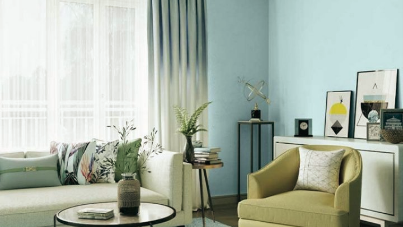 Bright living room featuring calming aqua blue walls and modern decor by mintpalhouse.