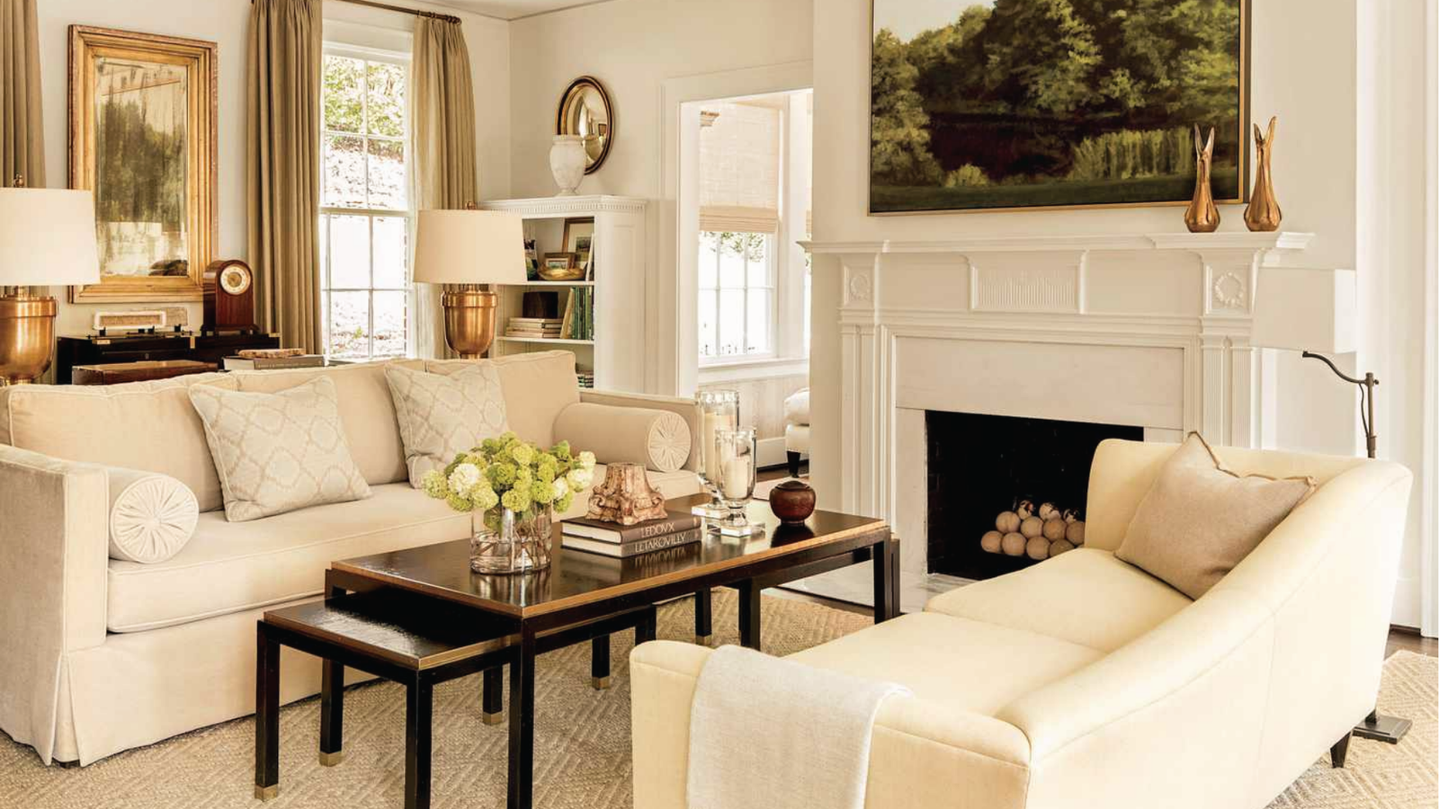 Classic cream painted living room with white fireplace and neutral decor for timeless appeal.