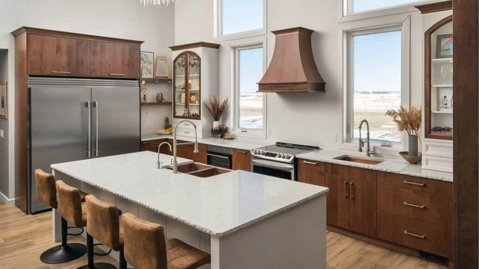 Medium brown cabinets, white walls, white quartz island, copper hood, warm rustic two-tone contrast